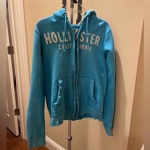 Hollister blue sized medium zipper jacket.